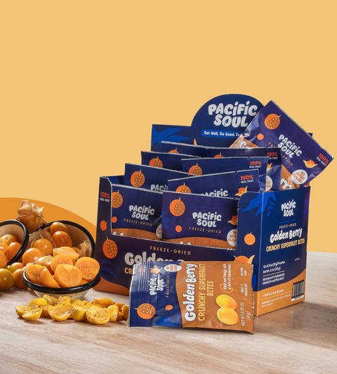 Pacific Soul Golden Berry snack packaging with freeze-dried fruit on a wooden surface and yellow background