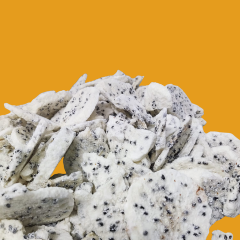 Freeze-dried yellow dragon fruit with seeds on a yellow background